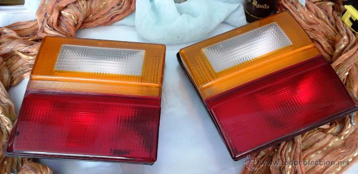Autos und Motorr&auml;der: PILOTOS TRASEROS. PAREJA. DE AUDI 100 22 E: