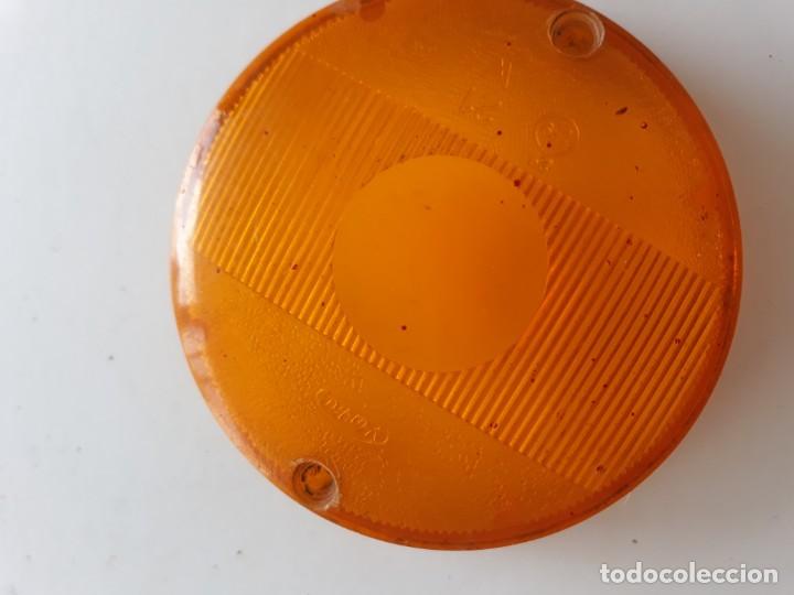 Automobili e Motociclette: Piloto naranja redondo