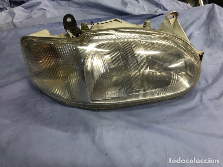 Autos und Motorr&auml;der: FARO FORD ESCORT 95 ( USADO)