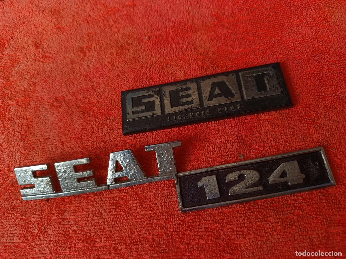 Coches y motocicletas: DOS ANTIGUOS LOGOS DE SEAT 124.