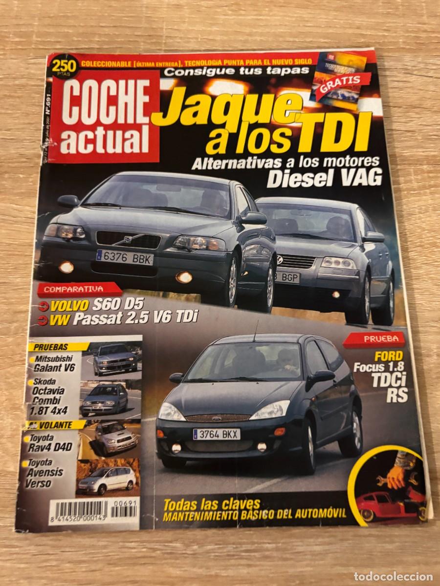 Autos: COCHE ACTUAL. N&ordm; 691. A&Ntilde;O 2001. PRUEBA: FORD FOCUS TDCi TREND RS. SKODA COMBI 1.8 T 4x4. LEER