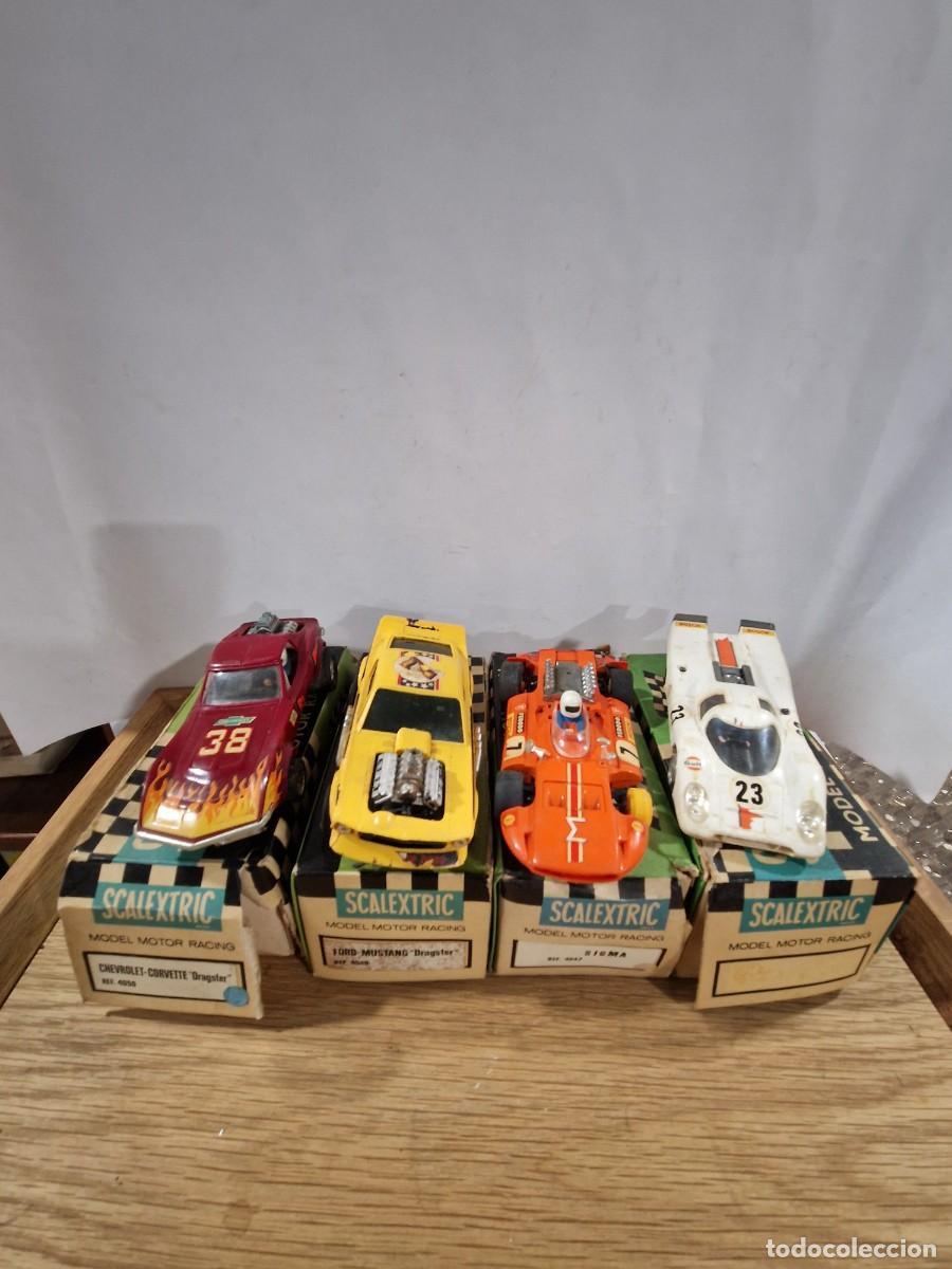Scalextric: 4 coches de Scalextric en sus cajas.
