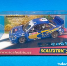 Scalextric: 1. COCHE SCALEXTRIC SUBARU IMPREZA WRC ”WORLD CHAMPION”. EFECTO NIEVE. REF: 6149. 2003.