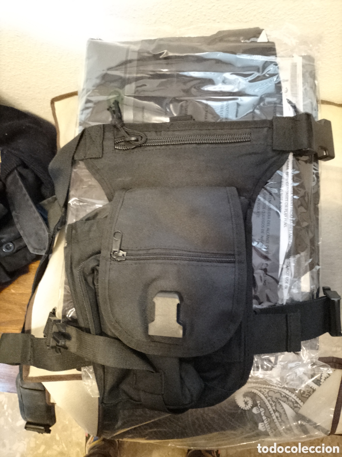 Segunda Mano: FUNDA DE ARMA CORTA PERNERA CON BOLSILLO Y PORTA CARGADOR