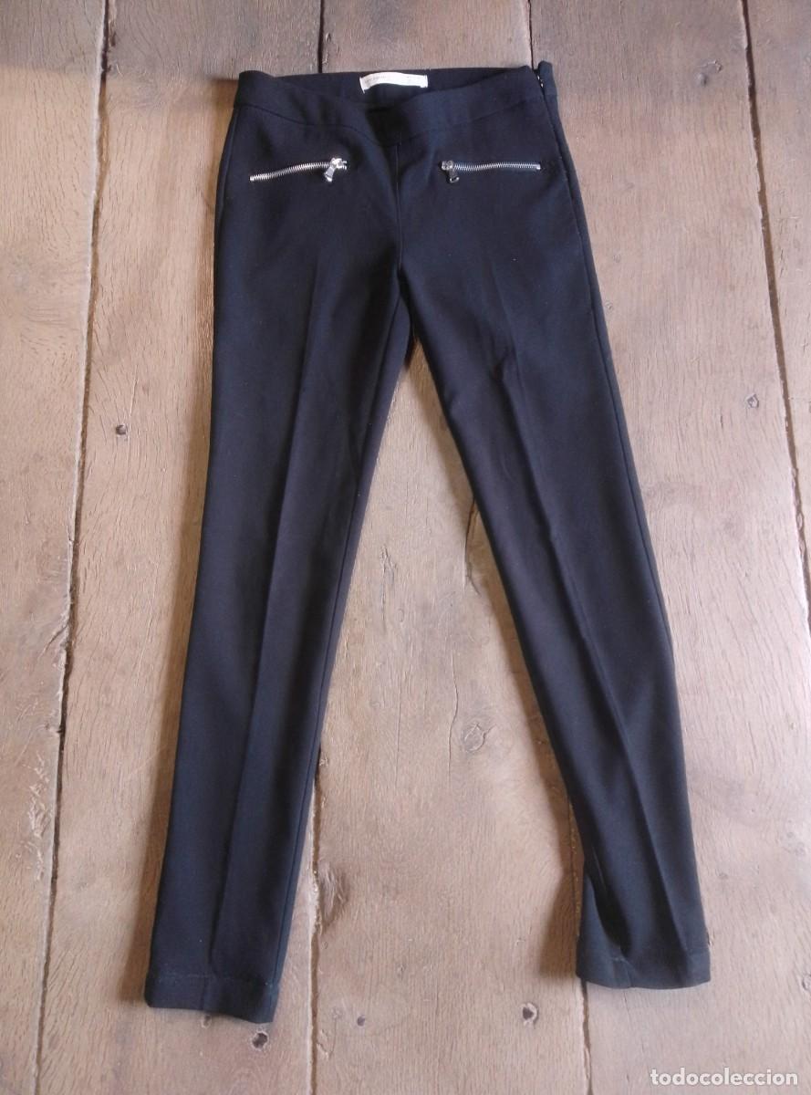 Segunda mano: Pantal&oacute;n negro con cremalleras. Tejido de invierno. Springfield. Talla 38