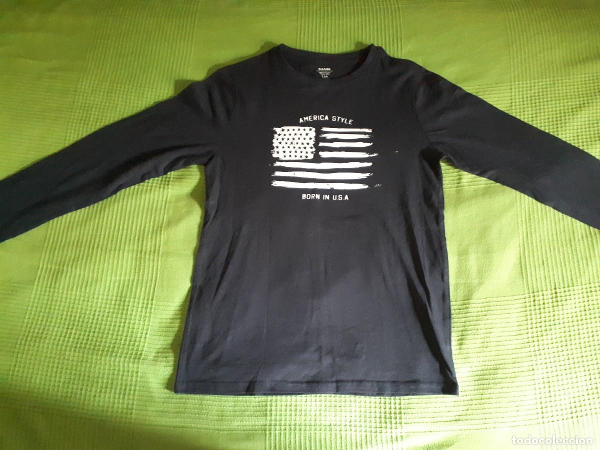 Segunda mano: CAMISETA BORN IN THE USA - MANGA LARGA - KIABI 12 A&Ntilde;OS