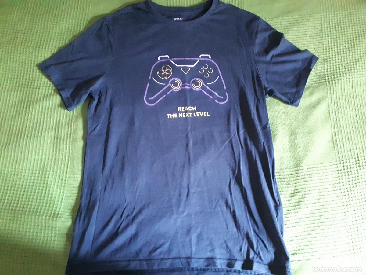 Segunda mano: CAMISETA REACH THE NEXT LEVEL - KIABI - MANGA CORTA 14 A&Ntilde;OS