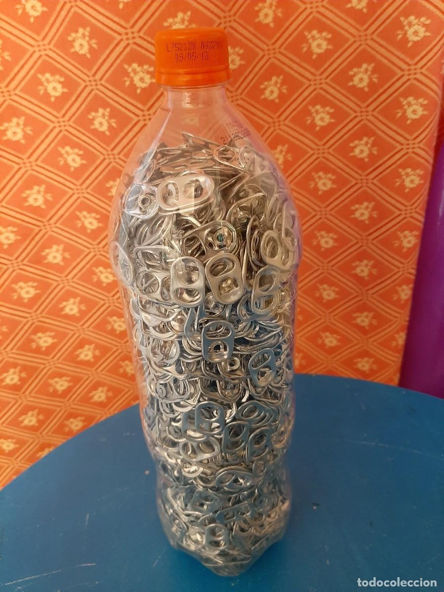Segunda mano: Botella llena de anillas - Foto 1