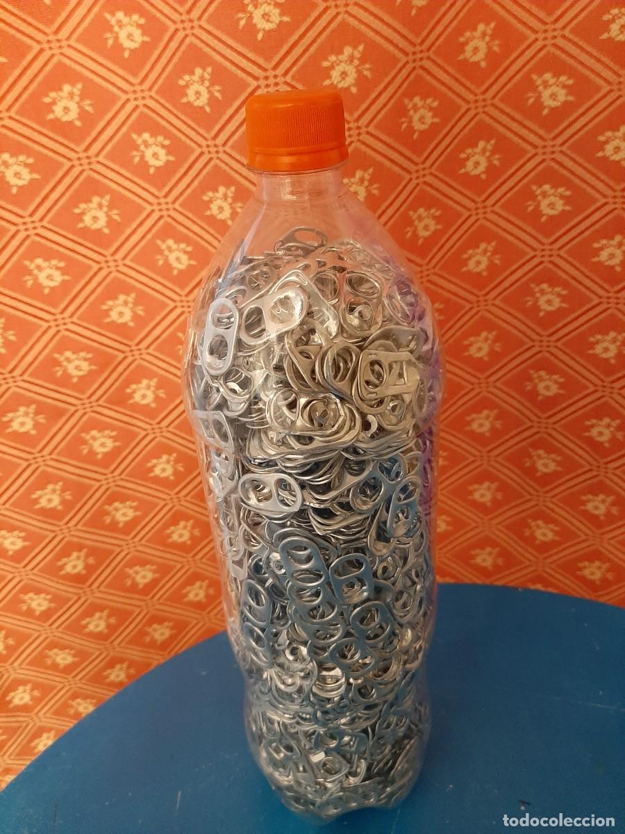 Segunda mano: Botella llena de anillas - Foto 2