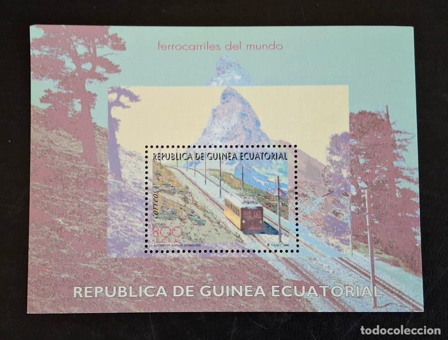 Sellos: Hoja Guinea Ecuatorial de 1995 muestra una locomotora antigua con un paisaje monta&ntilde;oso nevado