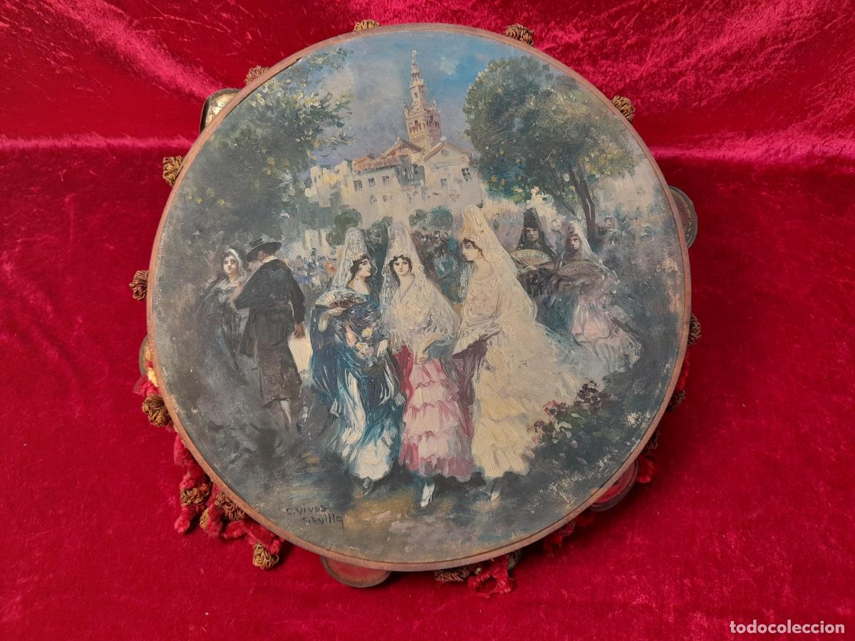 Sellos: PANDERETA DE MADERA PINTADA CON ESCENA COSTUMBRISTA SEVILLANA. FIRMADA POR C. VIVES. SIGLO XIX