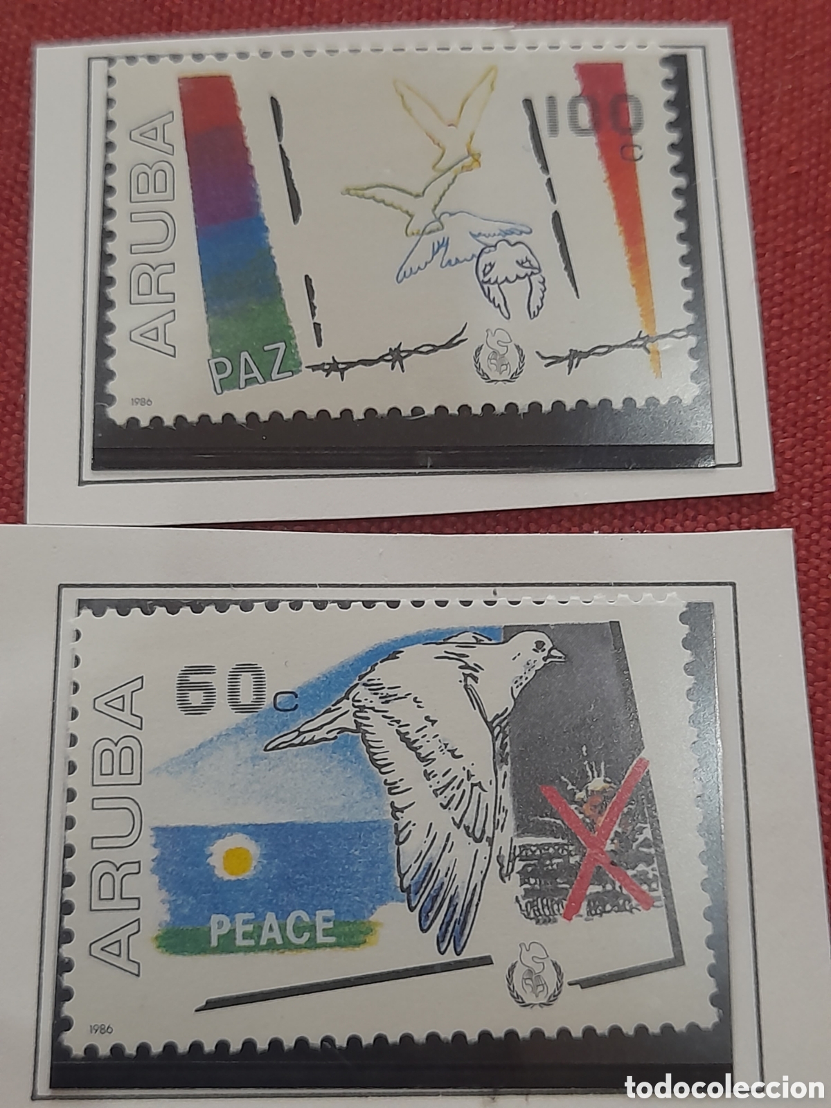 Sellos: Sello Aruba nuevo 1986. A&ntilde;o inter paz. Palomas. Aves. P&aacute;jaros. Fauna. Alambrada. Explosi&oacute;n.