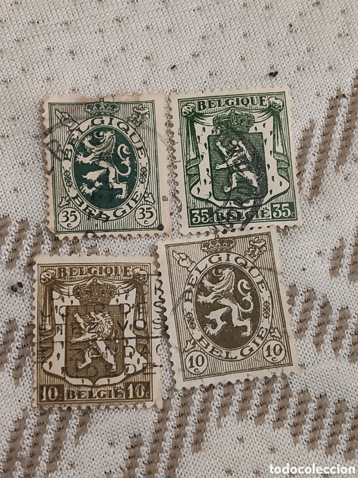 Sellos: 4 sellos de B&eacute;lgica escudo de armas Le&oacute;n rampante 1935 usados