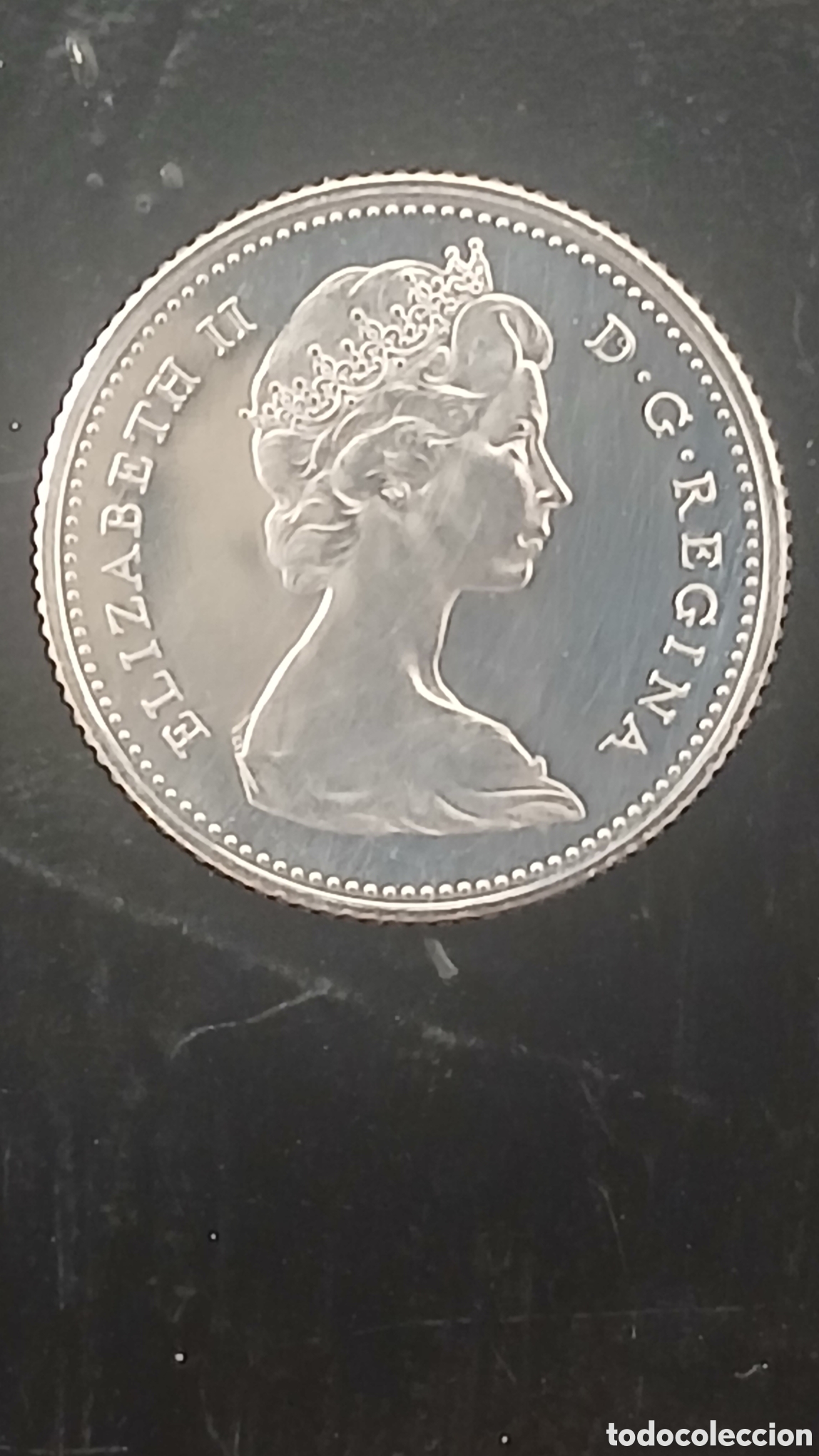 Sellos: Moneda de 25 centavos de Canad&aacute; con el retrato de la Reina Isabel II. - Canto con estr&iacute;as.