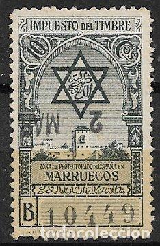 Sellos: MARRUECOS Impuesto del Timbre, 10 cts, negro (o) con serie y n&uacute;mero en el anverso