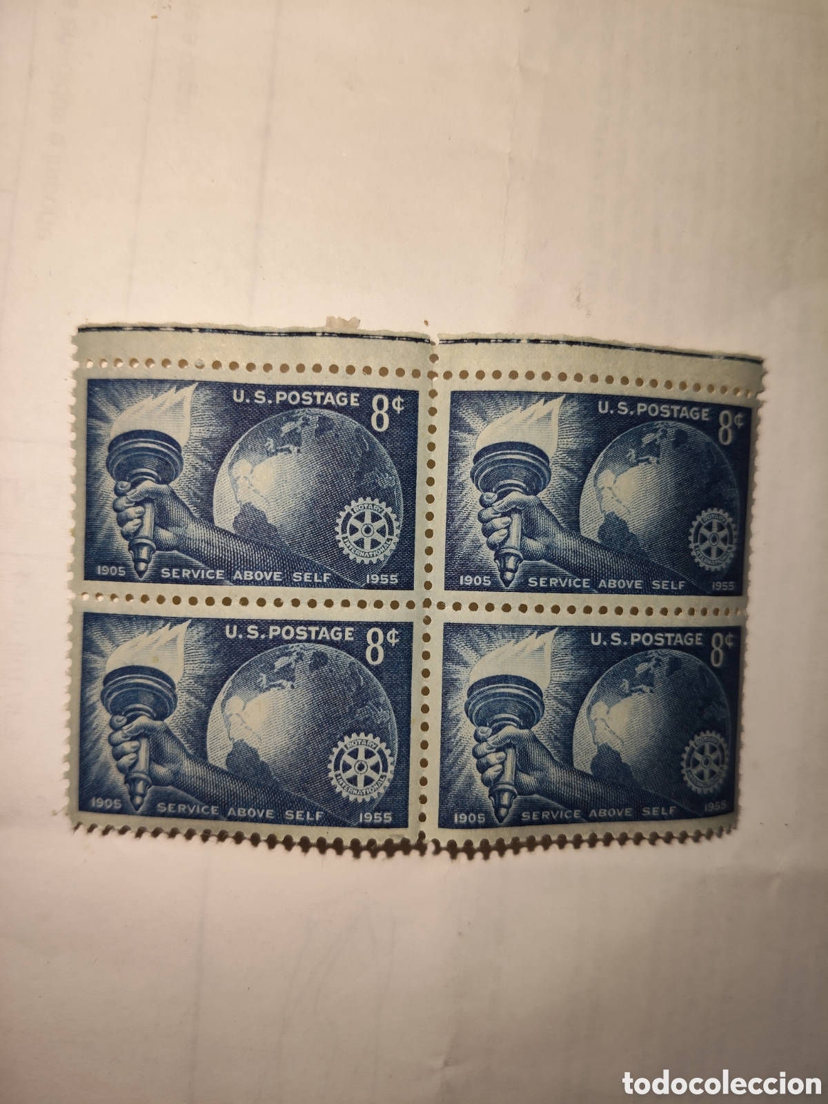 Sellos: Bloque de 4 sellos de Estados Unidos antorcha ,globo terr&aacute;queo y emblema rotario 1955