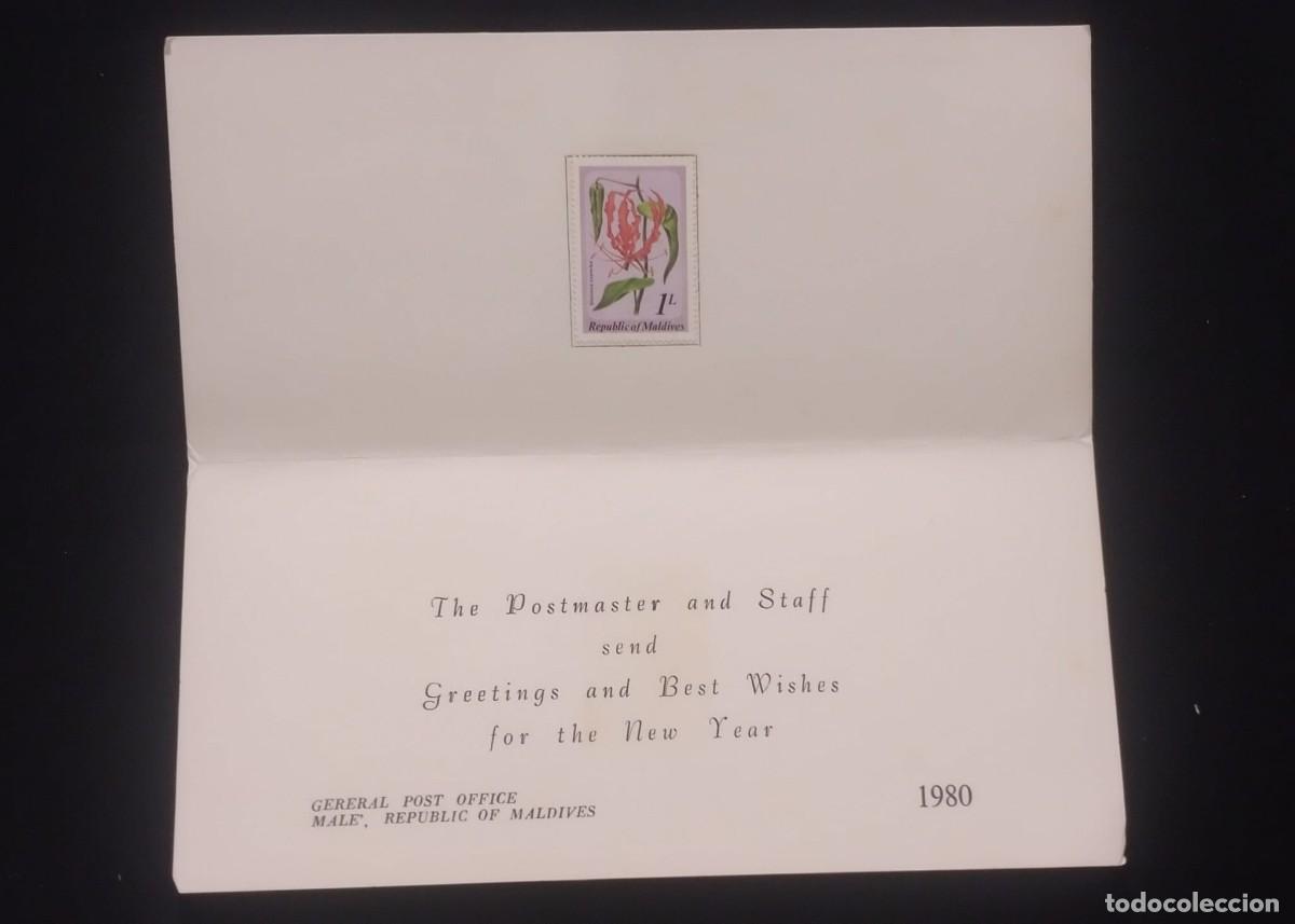 Sellos: TS) 1980 MALDIVES,FOLDED CARD NEW YEAR, WITH THE SPANISH FLAG FLOWER STAMP,XF.