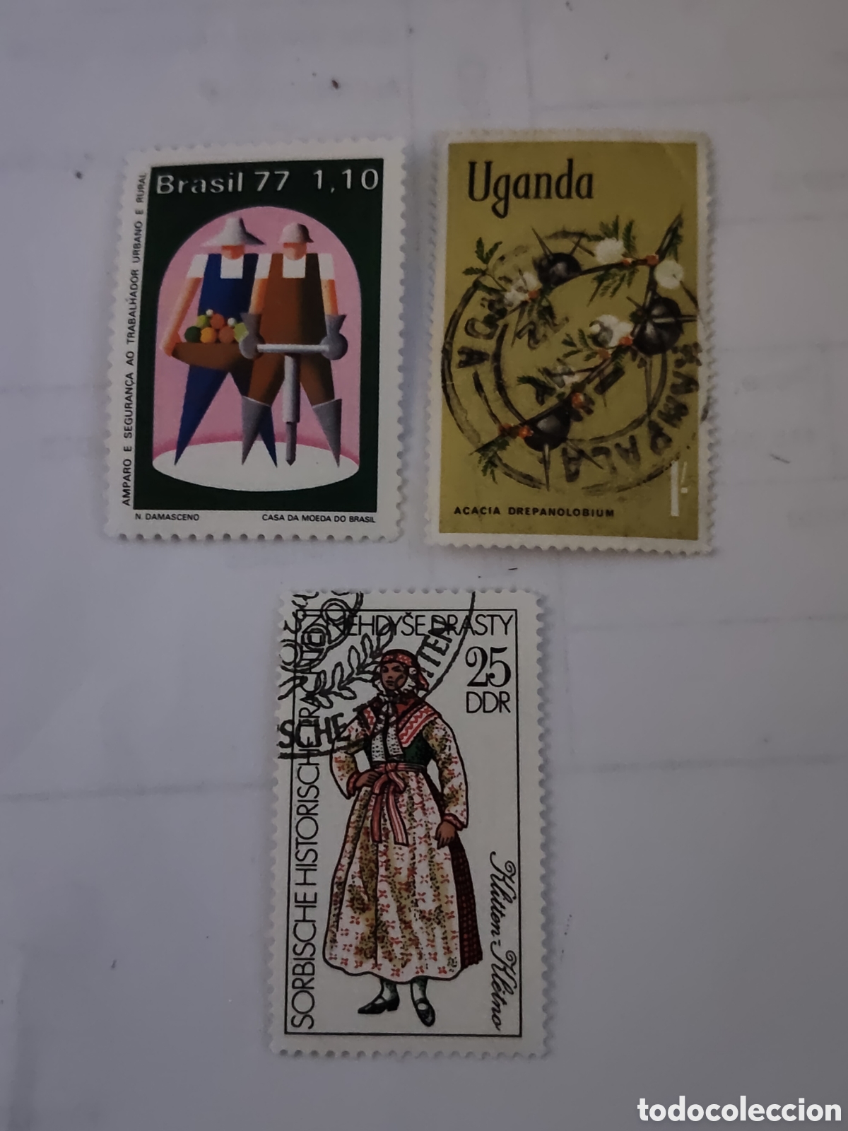 Timbres: 3 sellos de Uganda,Brasil y DDR