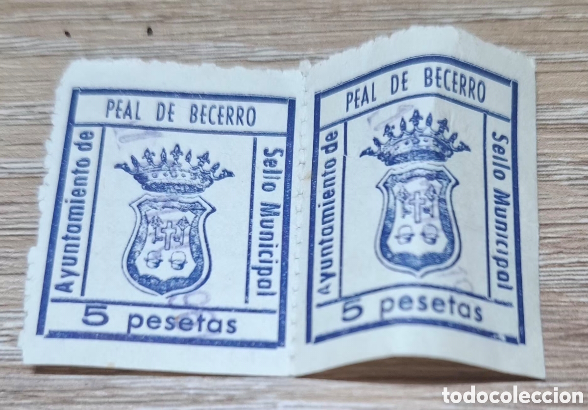 Sellos: un par de timbres fiscales municipales de color azul con el texto &laquo;Ayuntamiento de Peal de Becerro&raquo;,