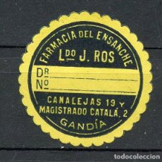 Sellos: GANDÍA (VALENCIA) ETIQUETA TROQUELADA FARMACIA DEL ENSANCHE, LICENCIADO J. ROS