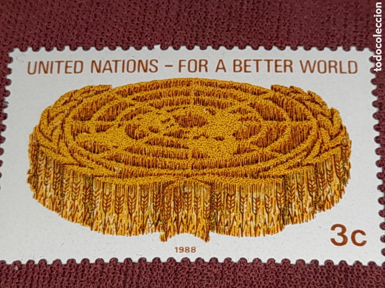 Sellos: Sello N. Unidas, N. York nuevo 1988. Por un mundo mejor. Emblema. Rama laurel.
