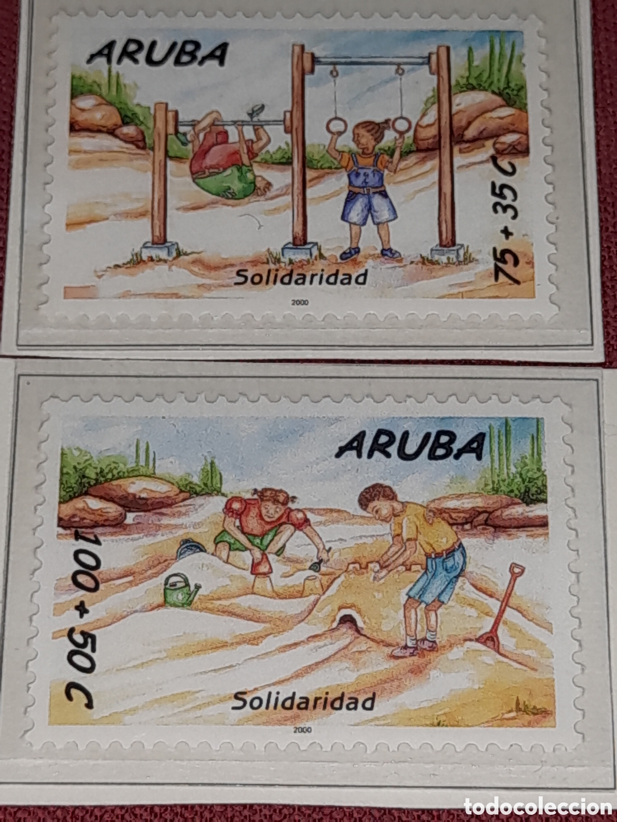 Sellos: Sello Aruba nuevo 2000. Solidaridad. Infancia. Playa. Juegos. Castillo arena. Anillas. Deporte Mar