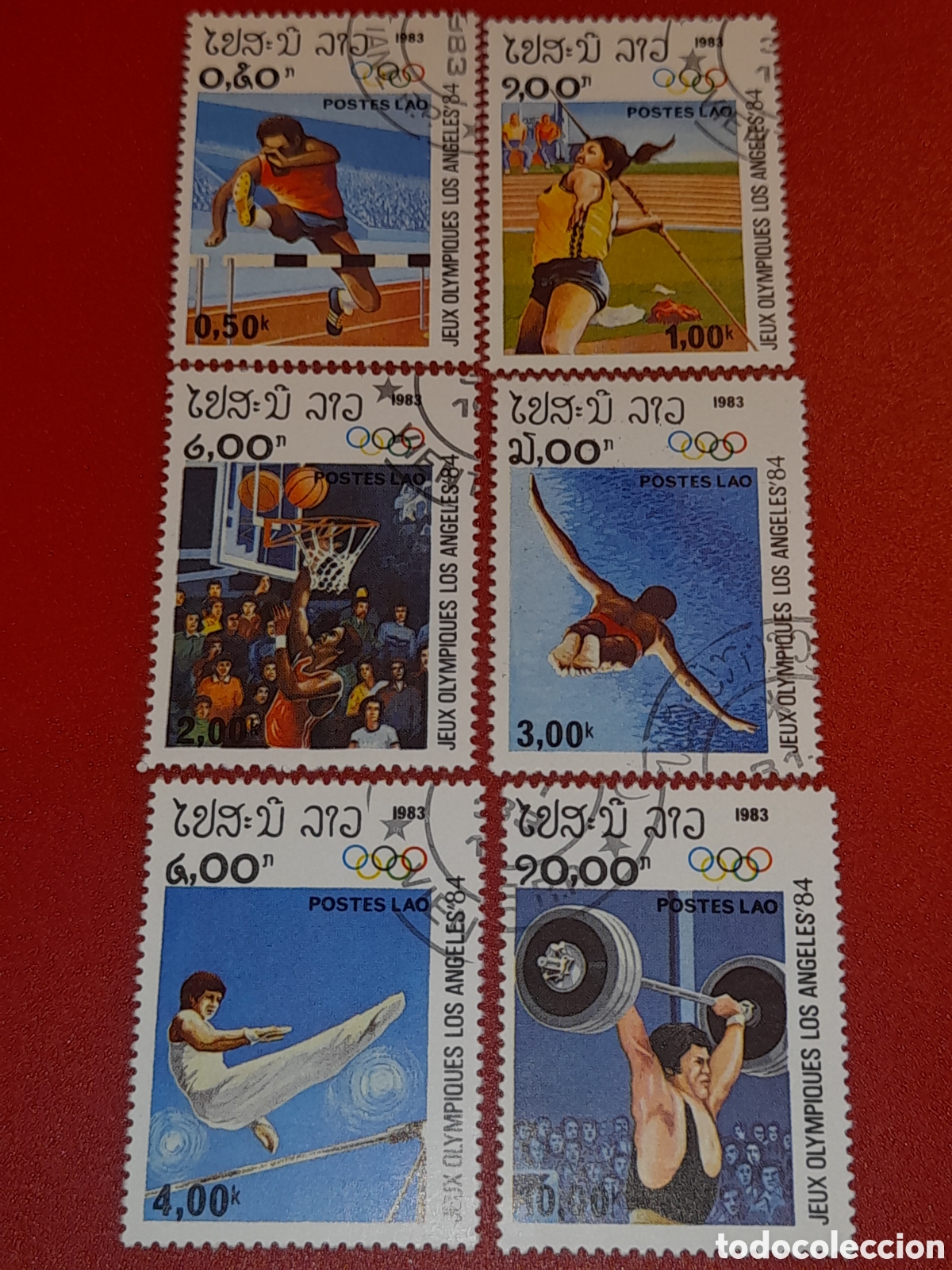 Sellos: Sello Laos mtdo 1983. Juegos olimpiada. Los &Aacute;ngeles. Deporte. Atletas. Nataci&oacute;n. Halterofilia. Balon