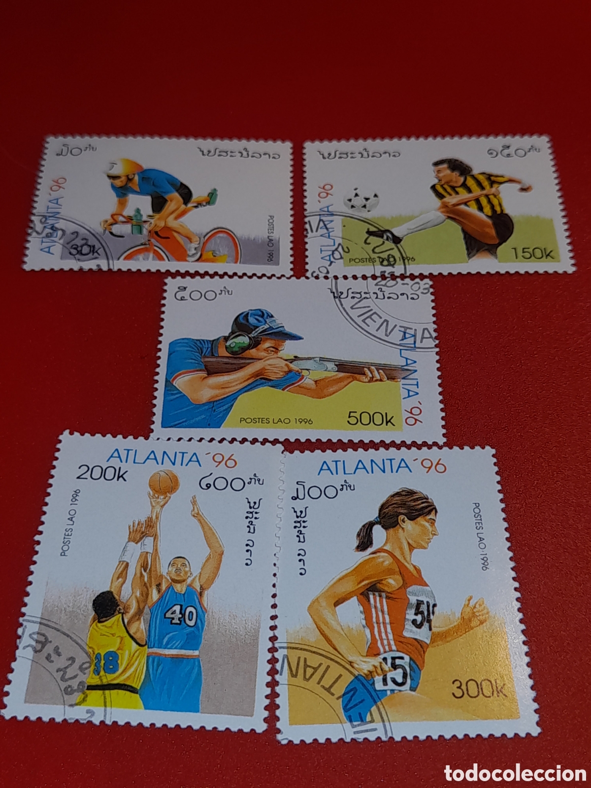 Sellos: Sello Laos mtdo 1996. Juegos olimpiada. Atlanta,96. Deporte. Ciclismo. Tiro. Rifle. F&uacute;tbol. Balonces