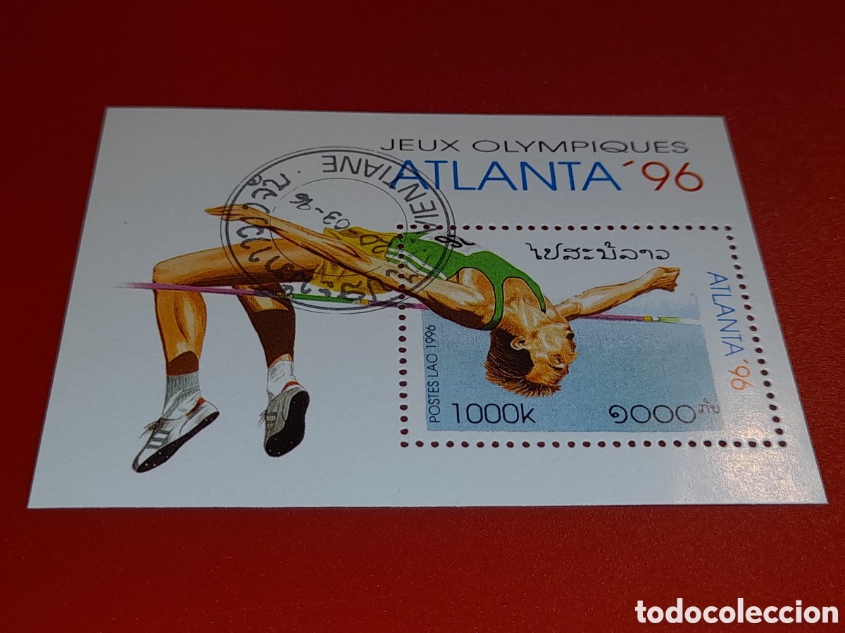 Sellos: Sello Laos mtdo 1996. Juegos olimpiada. Atlanta,96. Deporte. Salto altura. Atletas. Competici&oacute;n.