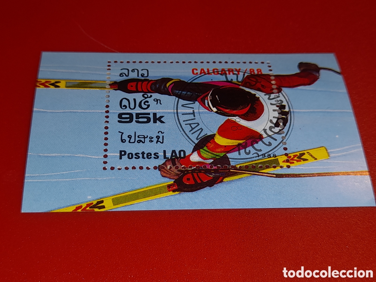 Sellos: Sello Laos mtdo 1996. Juegos olimpiada invierno. Calgary. Fondo. Esqu&iacute;. Patinaje.