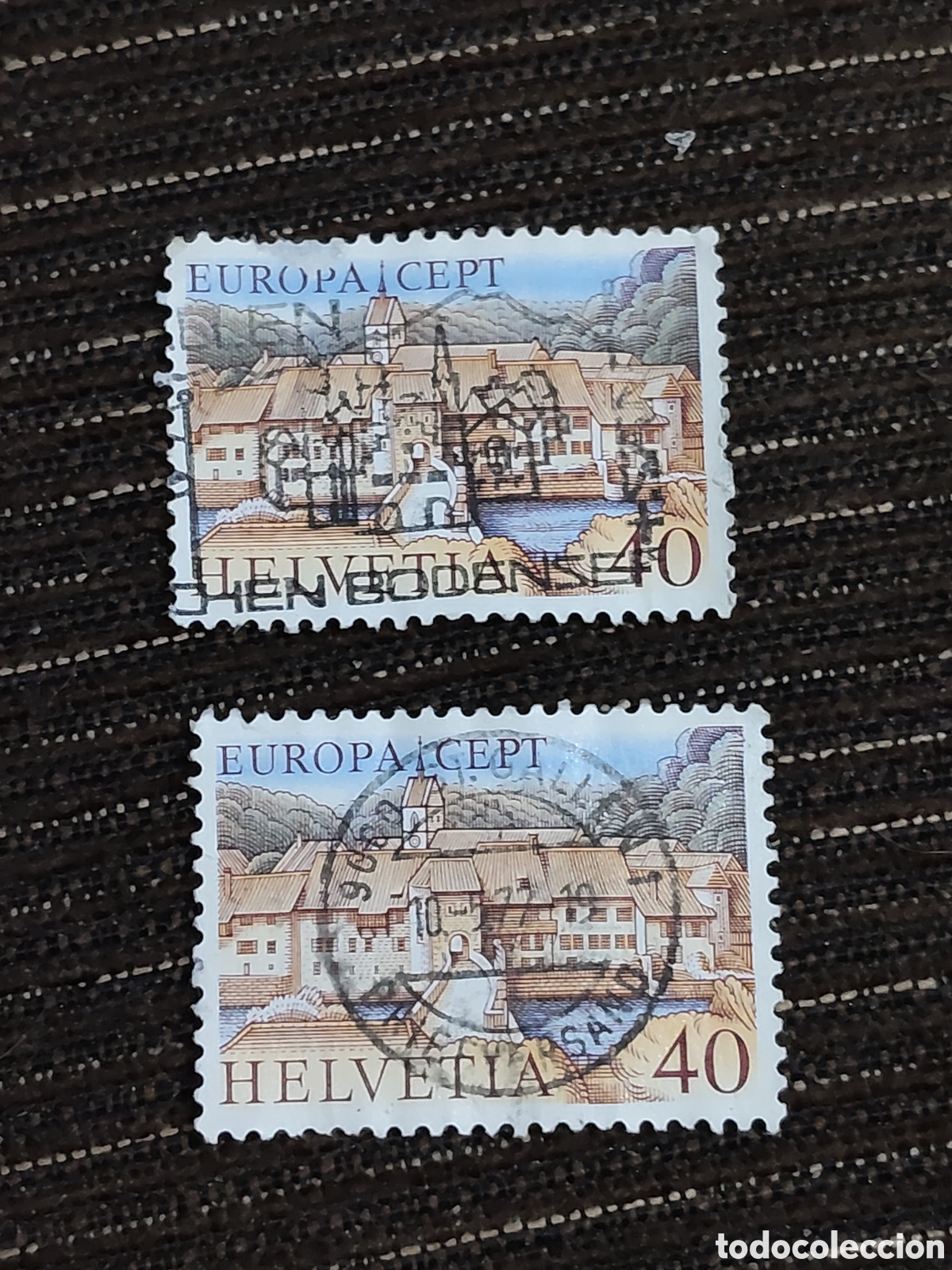 Sellos: 2 sellos de Suiza localidad medieval de Saint-Ursanne a orillas de r&iacute;o Doubs 1977