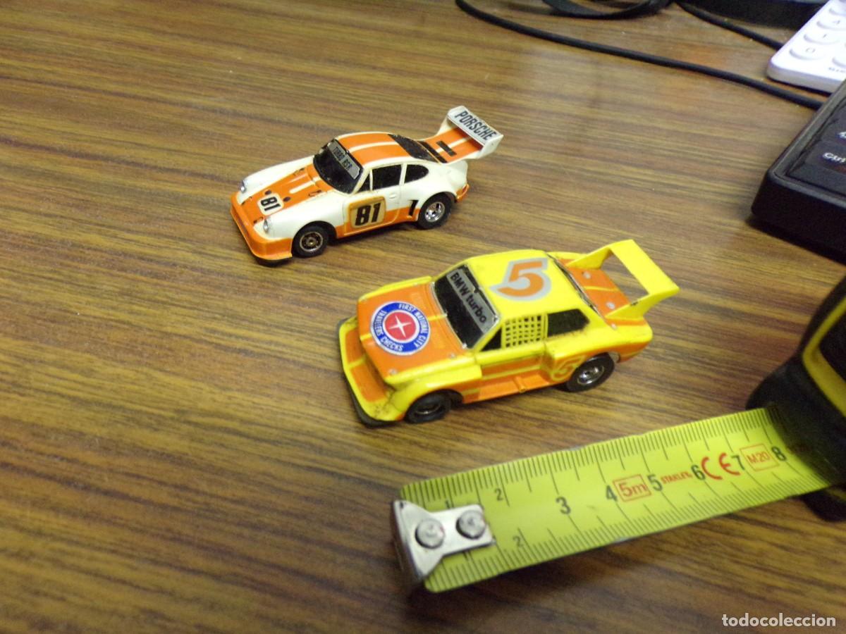 Slot Cars: pareja de coches tipo scalextric aurora singapore bmw porsche