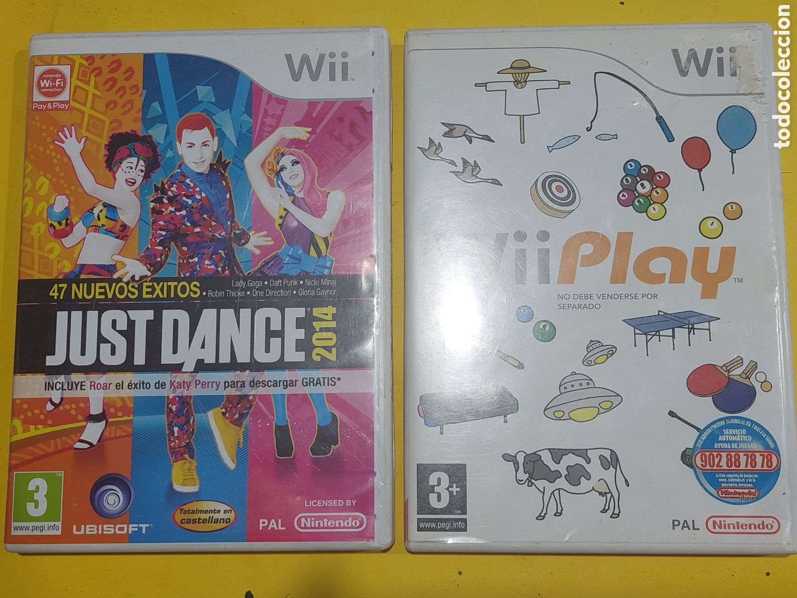 VIdeojuegos Just Dance y WiiPlay Nintendo Wii en su caja
