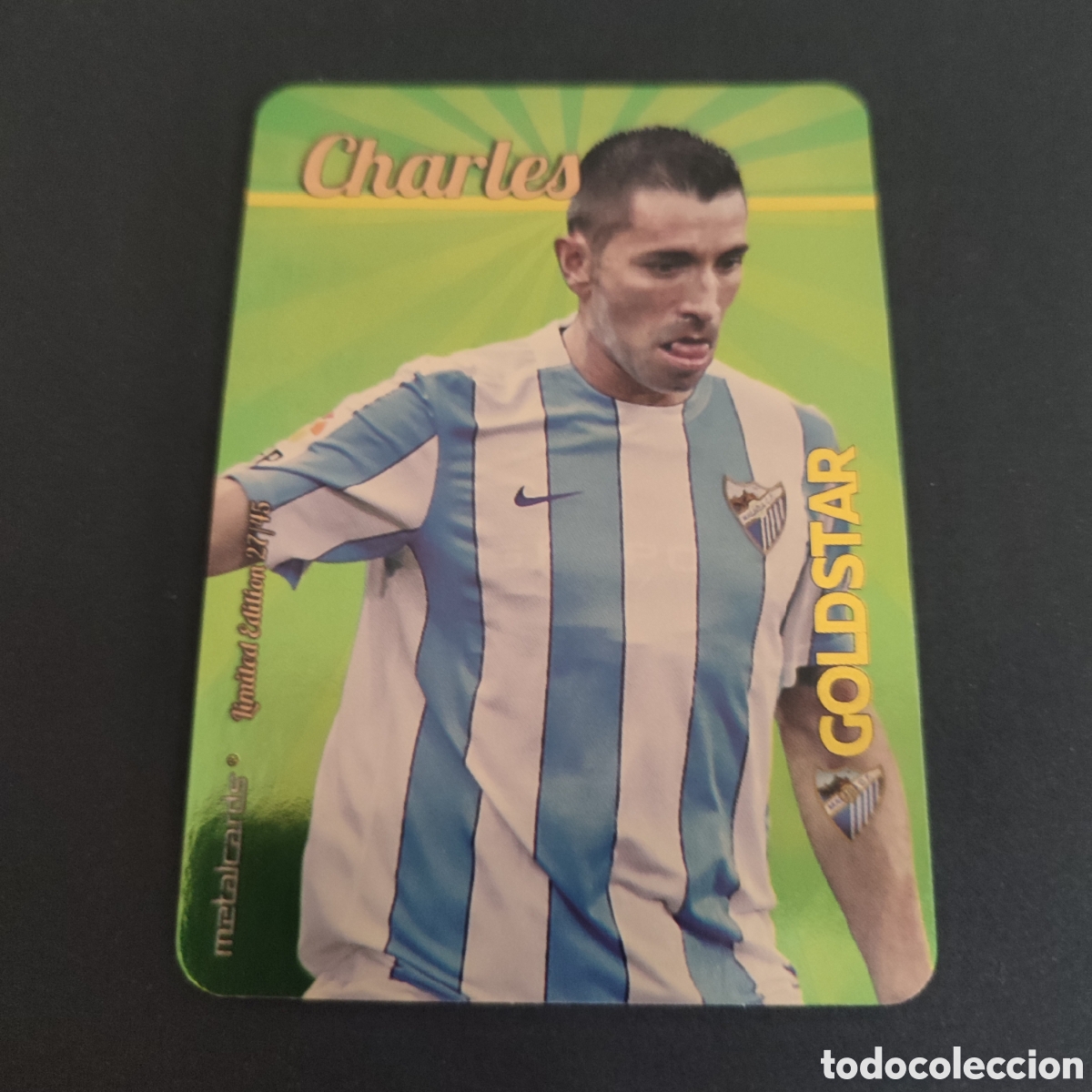 CHARLES (MALAGA C.F) GOLDSTAR BRILLO LISO DORADO , LIMITED EDITION 27/45 MUNDICROMO 2015 2016