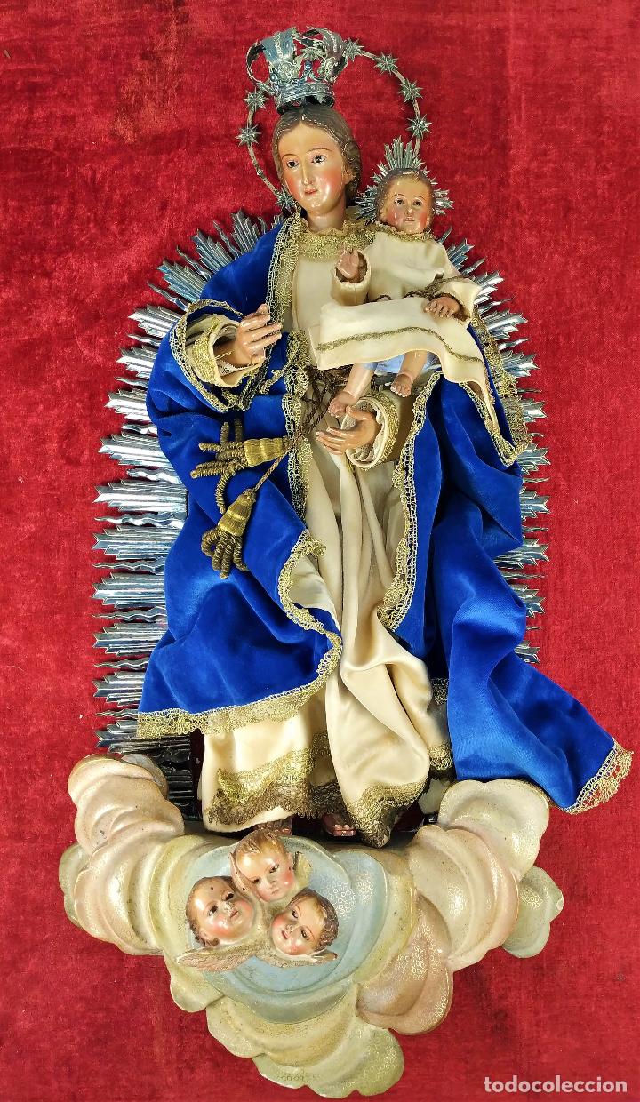 Virgen cap i pota con niño