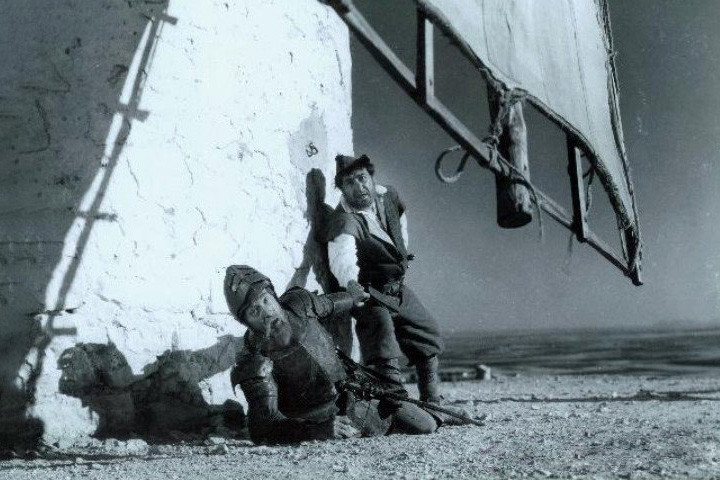 El Quijote y Sancho Panza en los molinos