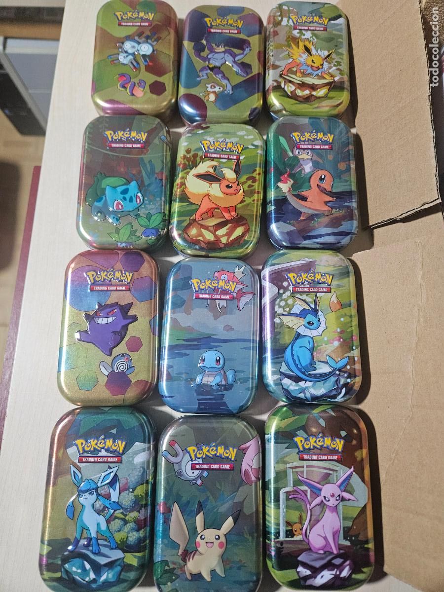 Trading Cards: 12 latas lata vac&iacute;a monedas Evoluciones prism&aacute;ticas prismatic evolutions cartas Pok&eacute;mon