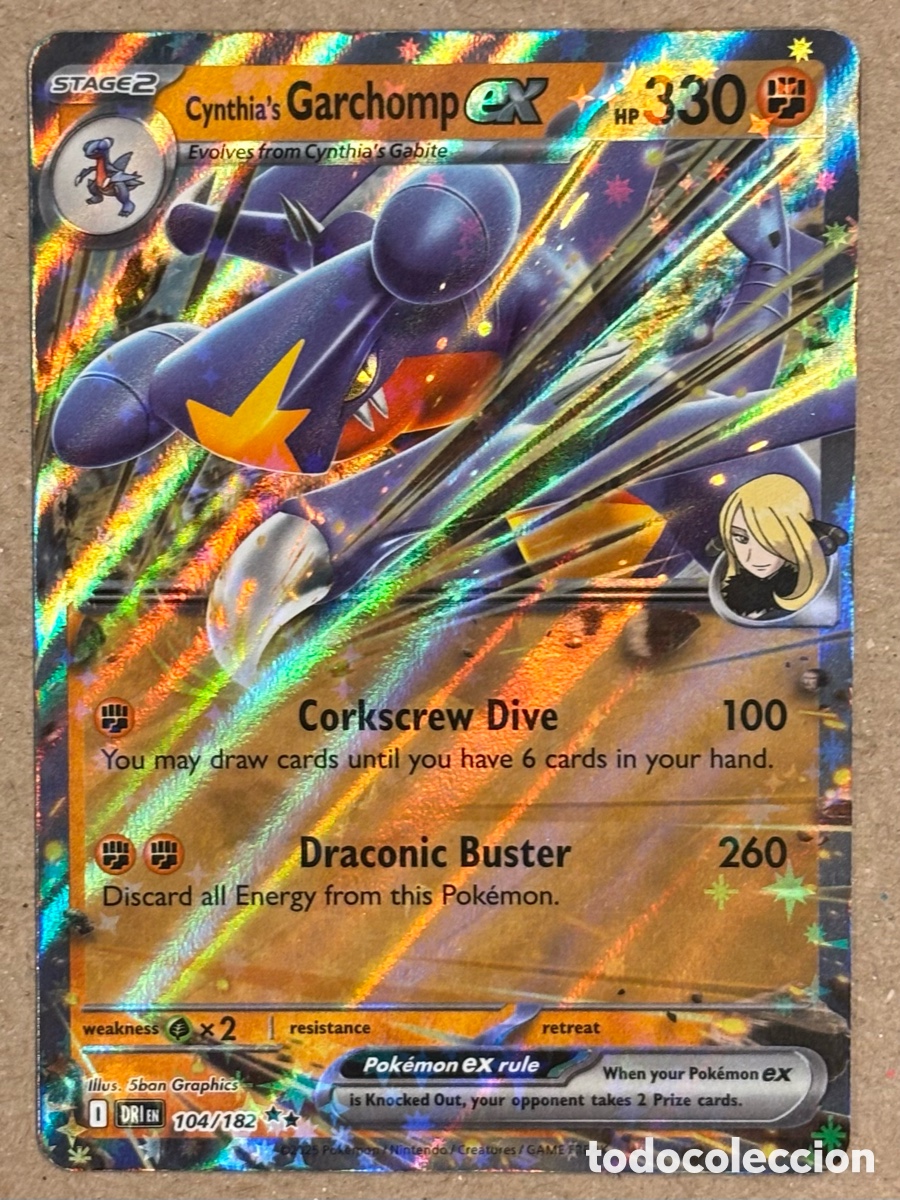 Trading Cards: CYNTHIA&rsquo;S GARCHOMP EX. CARTA POK&Eacute;MON RR #104/182. SCARLET & VIOLET: DESTINED RIVALS (DRIen).