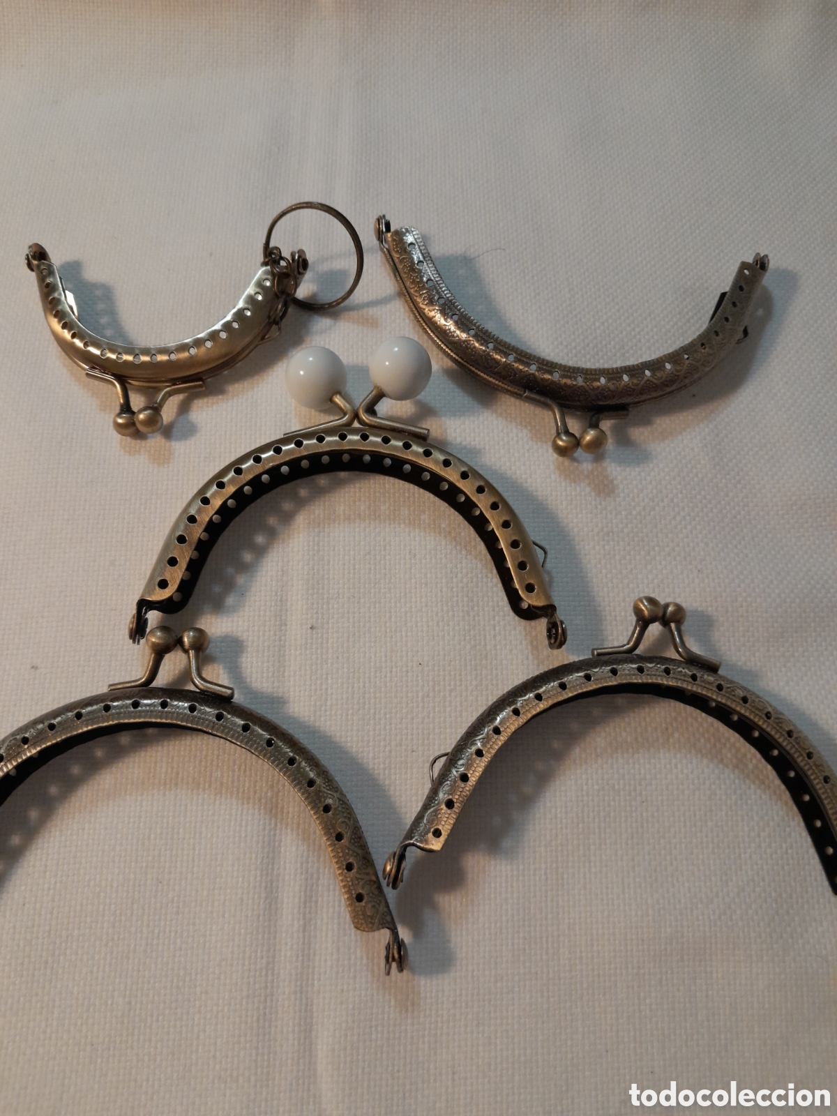 Otros Objetos de Arte: Boquillas metalicas para monederos