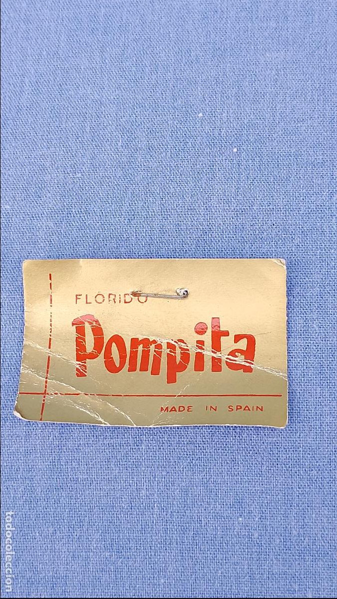 Vestidos mu&ntilde;ecas espa&ntilde;olas: Antigua etiqueta dorada original de mu&ntilde;eca Pompita de Florido, a&ntilde;os 60