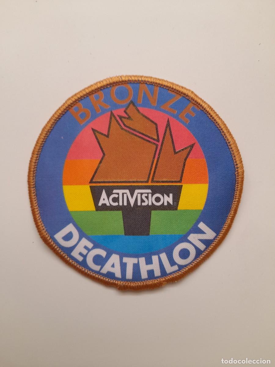 Videojuegos y Consolas: Parche del videojuego DECATHLON (Activision) en muy buen estado
