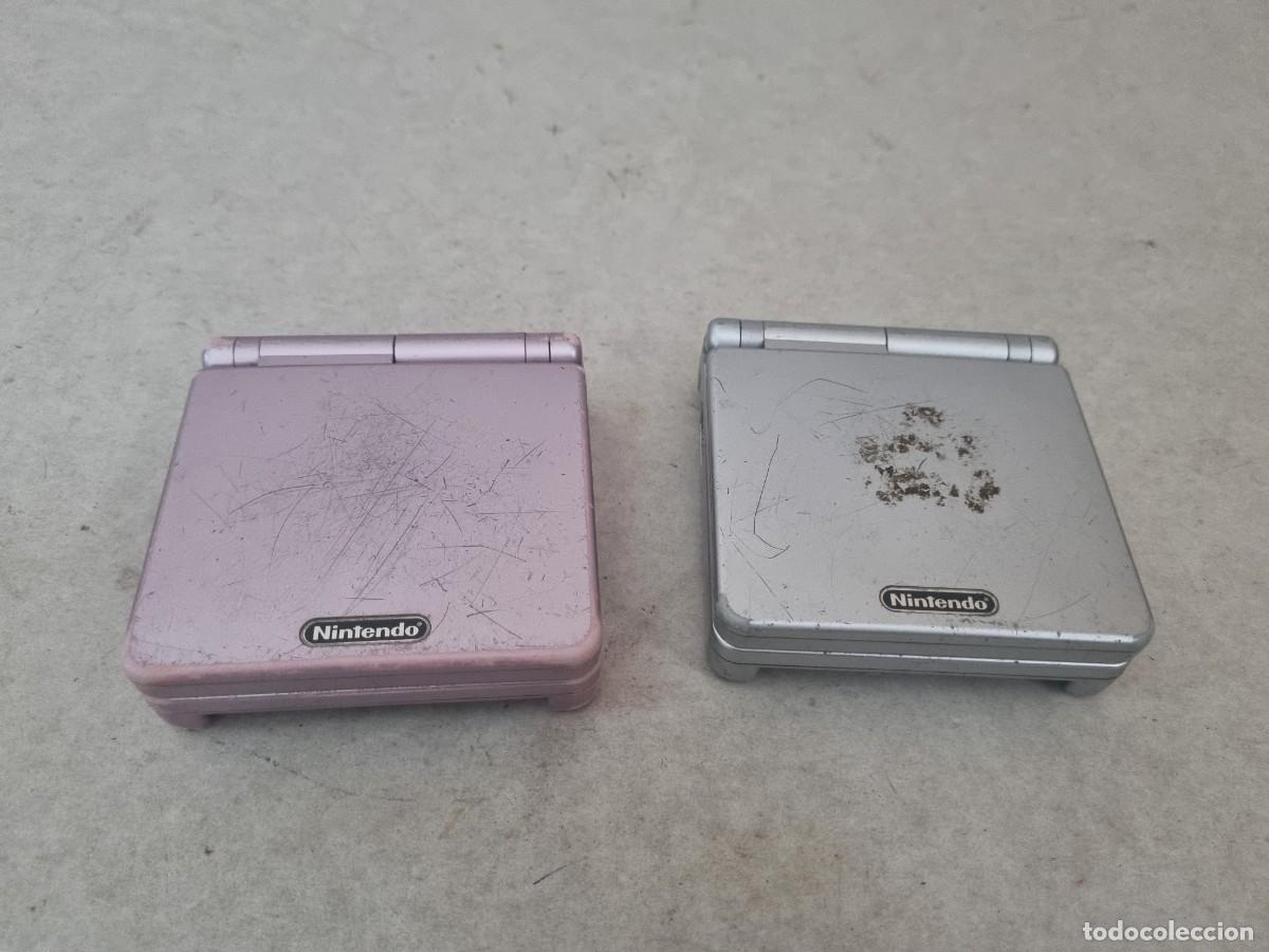 Videojuegos y consolas: Lote de 2 consolas Game Boy Advance SP. Rosa y Gris para reparar o pieazas