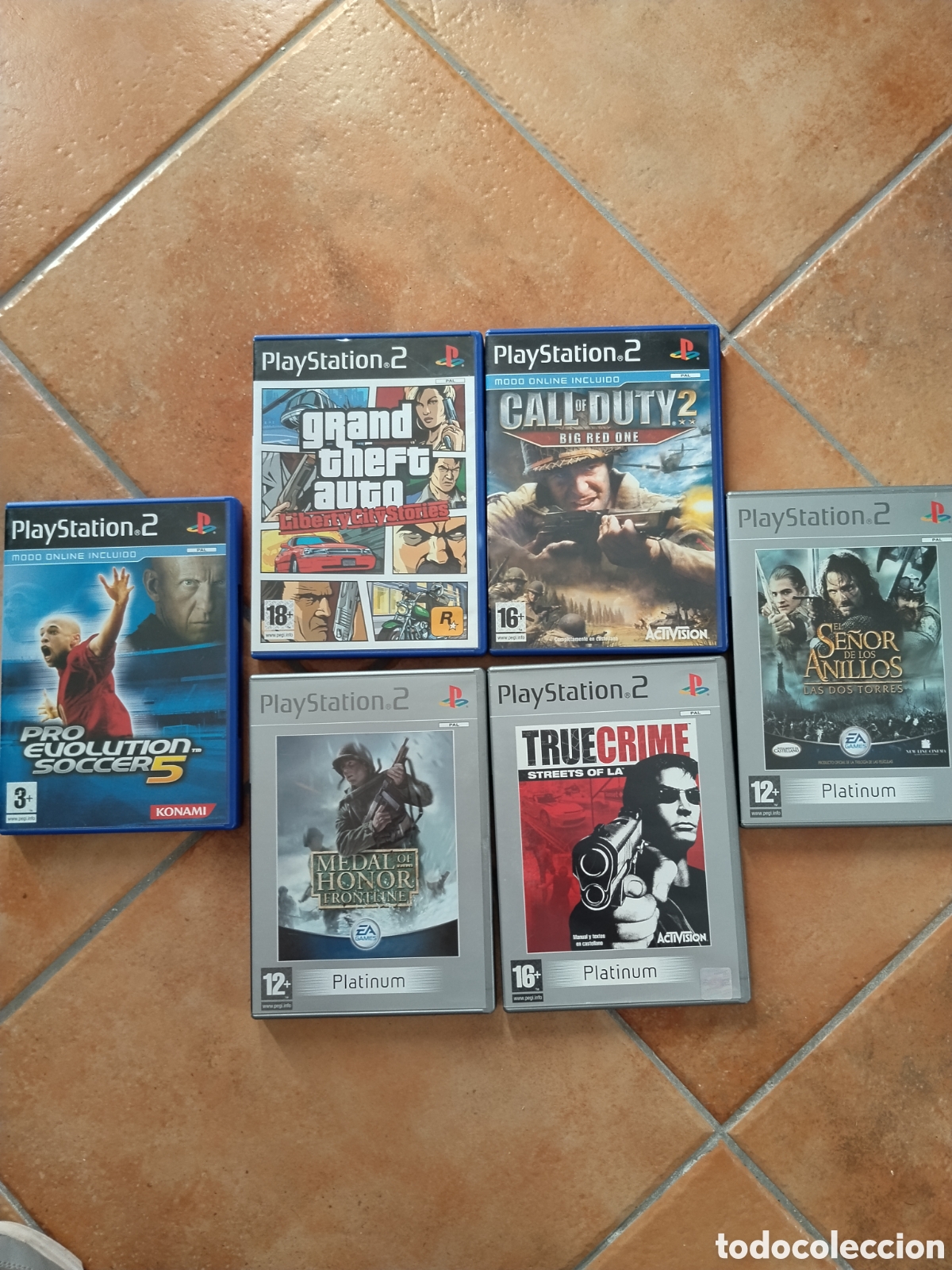 Videojuegos y consolas: Lote 5 juegos play station 2 + car&aacute;tula. GTA.call of duty.se&ntilde;or de los anillos.true crime.pro Evolut