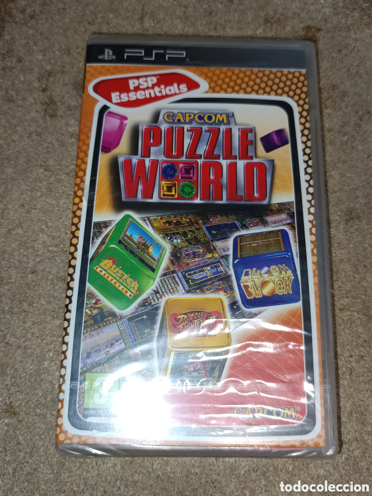Videojuegos y consolas: PSP CAPCOM PUZZLE WORLD ESSENTIALS PAL ESP NUEVO - Foto 1
