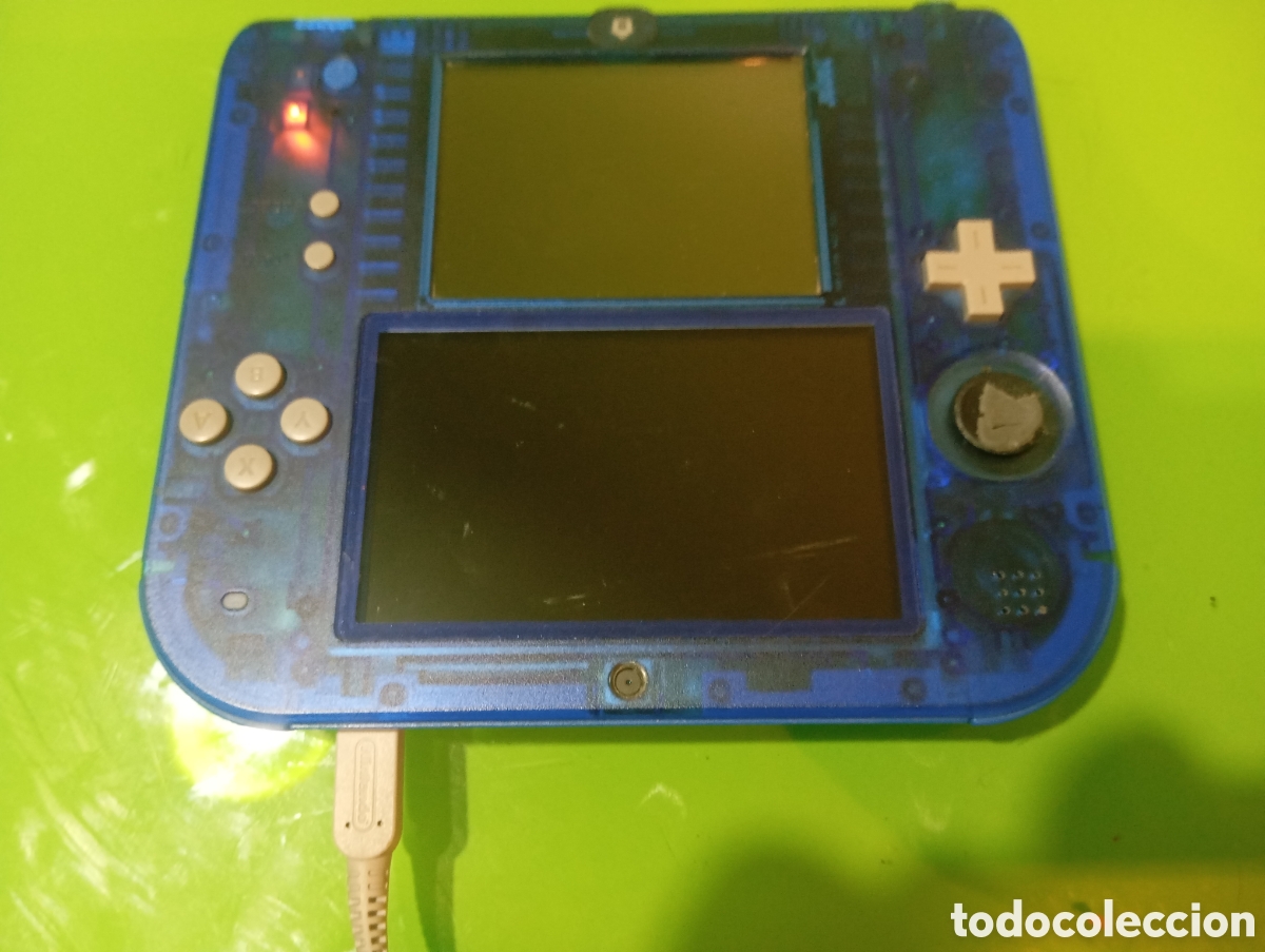 Videojuegos y consolas Nintendo 2DS de segunda mano: Nintendo 2DS(leer descripci&oacute;n) AZUL TRANSPARENTE + Cargador Original,no enciende