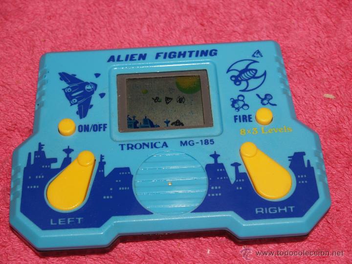 Videojuegos y consolas: ELECTRONIC GAME & WATCH TRONICA ALIEN FIGHTING HANDHELD GAME - Foto 1