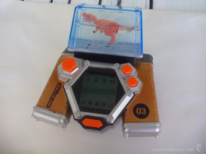 Videojuegos y consolas: Consola portatil Bio Bytes Jakks Pacific, versi&oacute;n 1.0. Con dinosaurio. - Foto 2