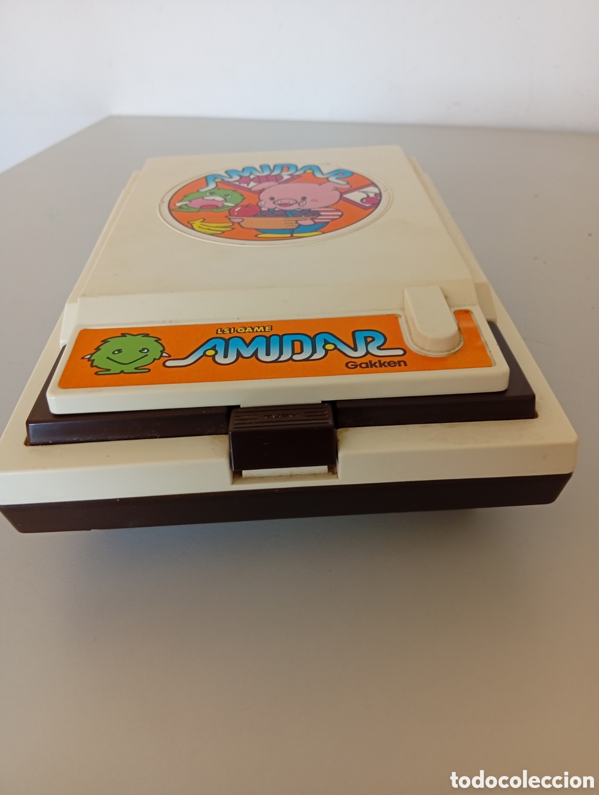 Videojuegos y Consolas: Videoconsola port&aacute;til a&ntilde;os 80 funcionando correctamente Amuidar juego tipo Pacman
