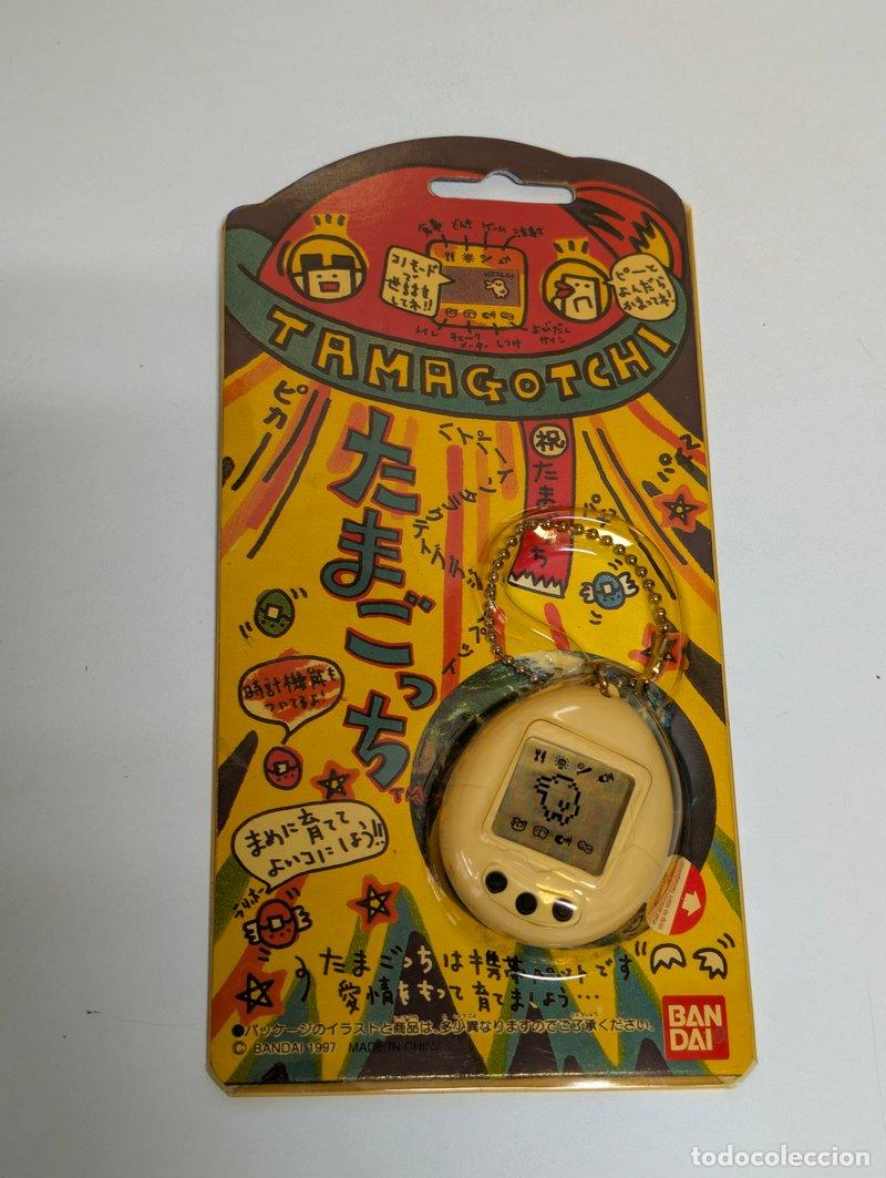 Videojuegos y consolas: Tamagotchi Bandai 1997 Jap&oacute;n blanco en bl&iacute;ster