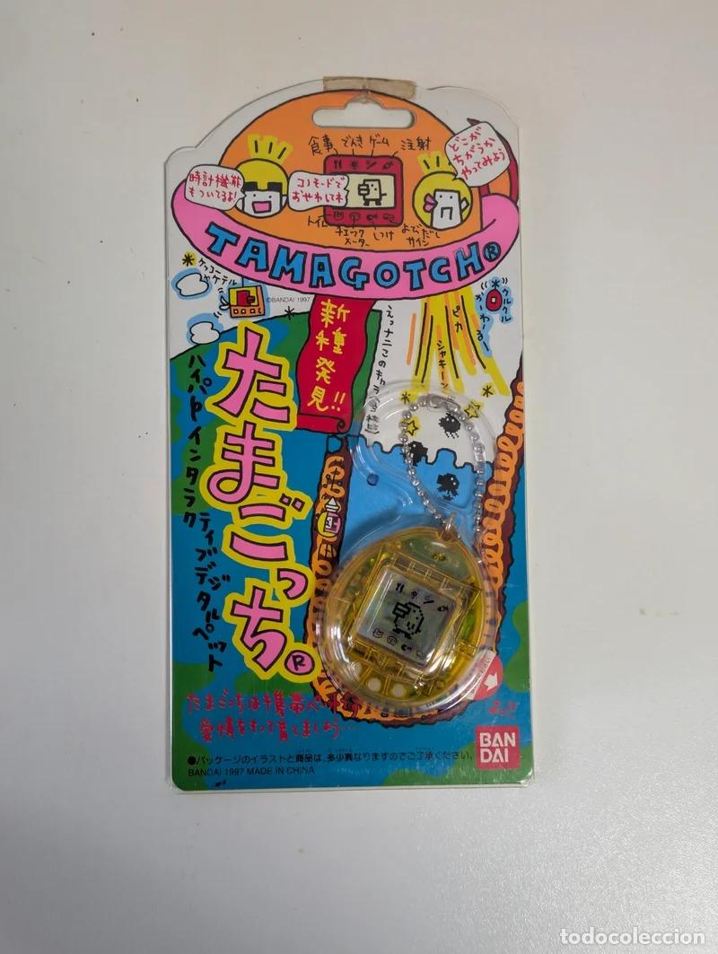 Videojuegos y consolas: Tamagotchi P2 1997 Bandai Jap&oacute;n amarillo transl&uacute;cido